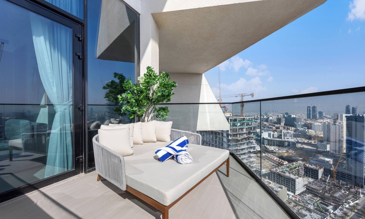 Madinat Zayed Apartment | Chic 1BR Retreat with Pool & Balcony JVC