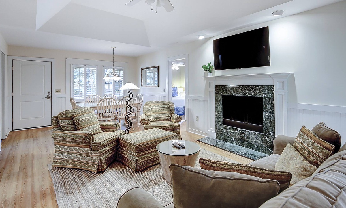 West Beach Condo | Modern, one-level condo near beach & golf with deck, sunroom, & pool