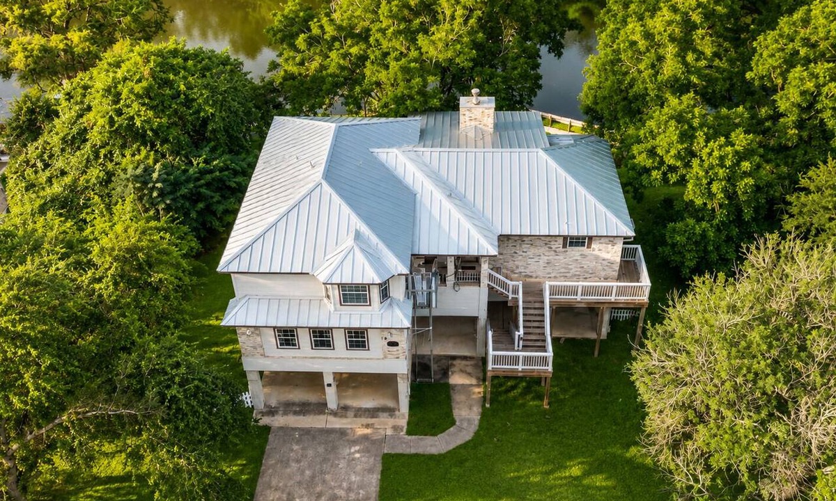 Seguin House | Riverfront retreat w/wraparound deck, Movie Room, Firepit