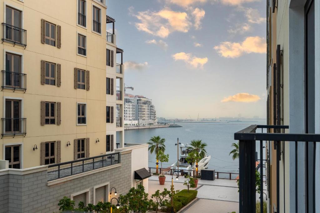 Dubai Apartment | Ultimate Stay - Stylish 1BR Apartment in La Mer Dubai with Balcony and Partial Marina Views