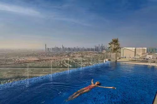 Jumeirah Village Triangle Apartment | Vogue Vacation Homes, Novotel Residences JVT near Springs Souk Mall, One Bedroom apartment with Balcony and Vibrant Community View, Access to all Amenities