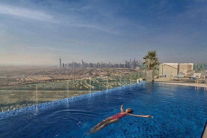 Jumeirah Village Triangle Apartment | Vogue Vacation Homes, Novotel Residences JVT near Springs Souk Mall, One Bedroom Apartment with Large Balcony and Vibrant Community view, Access to all Amenities