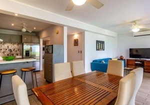 Elegant Condo with Brand-New Fixtures, Shaded Tropical Terrace, and Secluded Bea