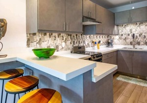 Elegant Condo with Brand-New Fixtures, Shaded Tropical Terrace, and Secluded Bea