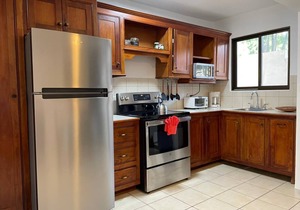 Two Bedroom condo with Great Roof Terrace and walking distance to the beach