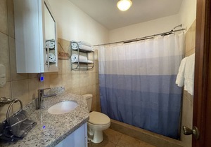 Two Bedroom condo with Great Roof Terrace and walking distance to the beach