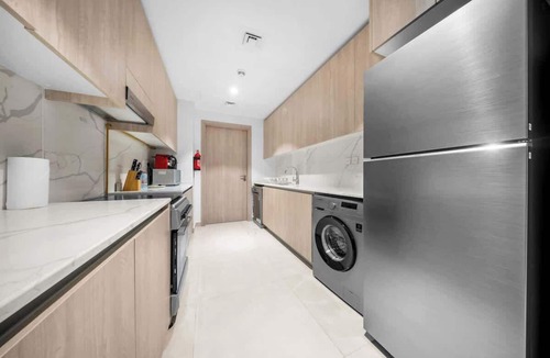 Jumeirah Village Circle Apartment | 1BR for 8 nr Circle Mall | Pvt Garden | Pool view