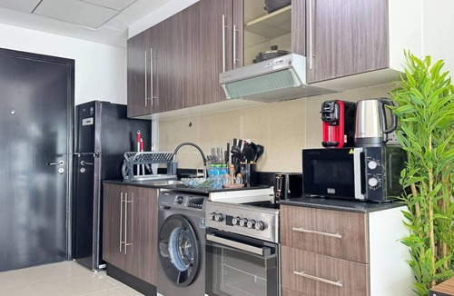 Abu Dhabi Apartment | Al Reef Peaceful Studio: King Bed Comfort for 2