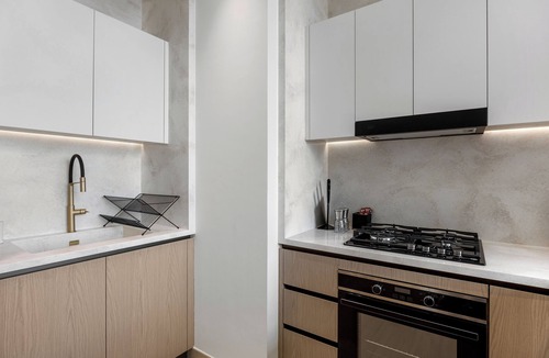 Madinat Zayed Apartment | Chic 1BR Retreat with Pool & Balcony JVC
