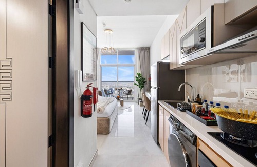 Al Barsha Apartment | Cozy Studio with 31st Floor Miracle Garden View