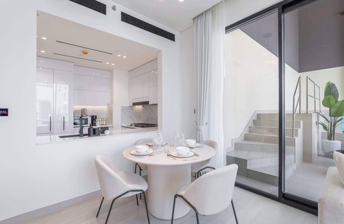 Jumeirah Village Circle Apartment | Free housekeeping visits during your stay - StayShort - Luxury 2BR with Private Pool & Skyline Terrace | JVC