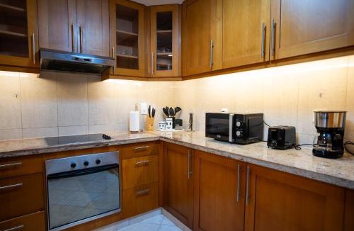 The Greens Apartment | Luxury 2BR Haven with Panoramic Scenery