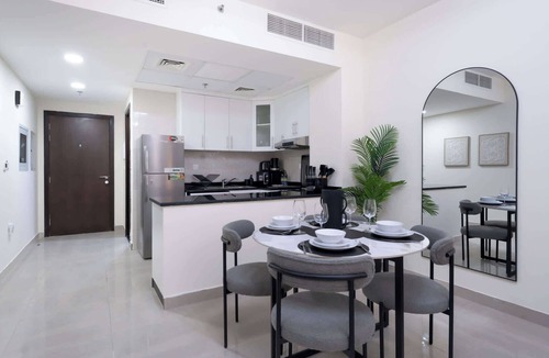 Jumeirah Village Circle Apartment | Spacious Studio Apartment with Balcony that Sleeps 4