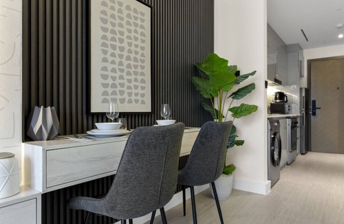 Business Bay Apartment | Studio Retreat with Canal and Burj Khalifa Views