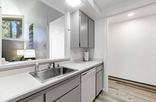 Graeagle Condo | This light-filled alpine retreat blends rustic charm with modern style.