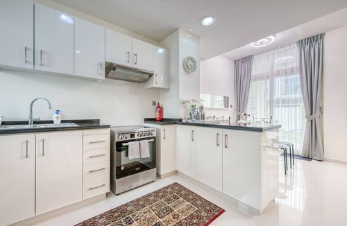Dubai Ski Chalet | Tranquil 3BR Townhouse at Albizia Damac Hills 2 by Deluxe Holiday Homes
