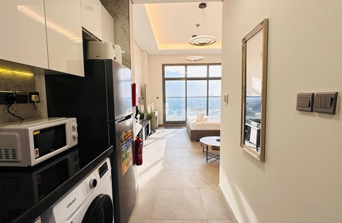 Business Bay Apartment | Upscale Apartment at Oval Tower Near Downtown with Balcony and Parking by Belvilla