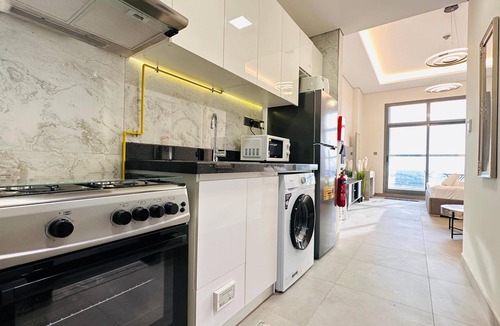 Business Bay Apartment | Upscale Apartment at Oval Tower Near Downtown with Balcony and Parking by Belvilla