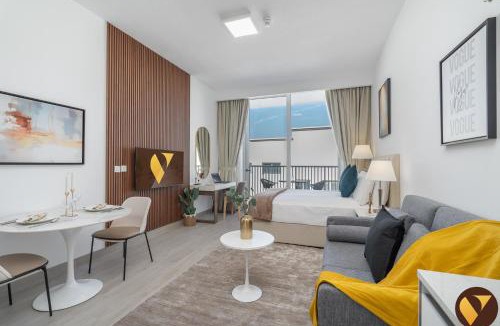Jumeirah Village Circle Apartment | Vogue Vacation Homes, JVC Luma22 near Circle Mall, Studio Apartment with Balcony and Vibrant Community View, Access to all Amenities