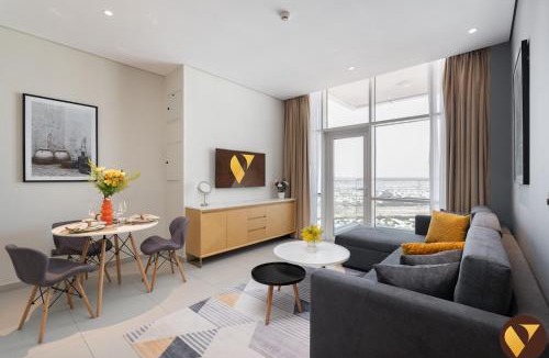 Jumeirah Village Triangle Apartment | Vogue Vacation Homes, Novotel Residences JVT near Springs Souk Mall, One Bedroom apartment with Balcony and Vibrant Community View, Access to all Amenities