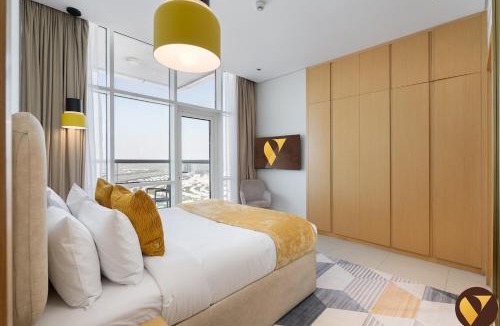 Jumeirah Village Triangle Apartment | Vogue Vacation Homes, Novotel Residences JVT near Springs Souk Mall, One Bedroom apartment with Balcony and Vibrant Community View, Access to all Amenities