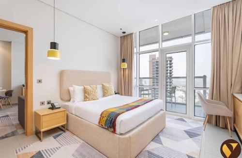 Jumeirah Village Triangle Apartment | Vogue Vacation Homes, Novotel Residences JVT near Springs Souk Mall, One Bedroom Apartment with Large Balcony and Vibrant Community view, Access to all Amenities