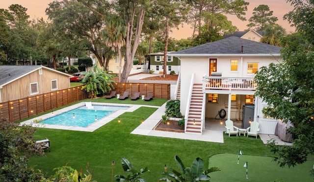 Updated 4th row beach home, private pool, fenced in yard, and putting green!
