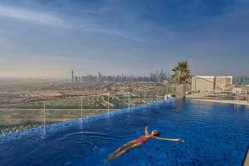 Vogue Vacation Homes, Novotel Residences JVT near Springs Souk Mall, One Bedroom apartment with Balcony and Vibrant Community View, Access to all Amenities