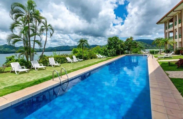 Elegant Condo with Brand-New Fixtures, Shaded Tropical Terrace, and Secluded Bea