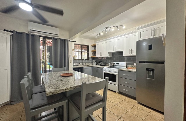 Two Bedroom condo with Great Roof Terrace and walking distance to the beach